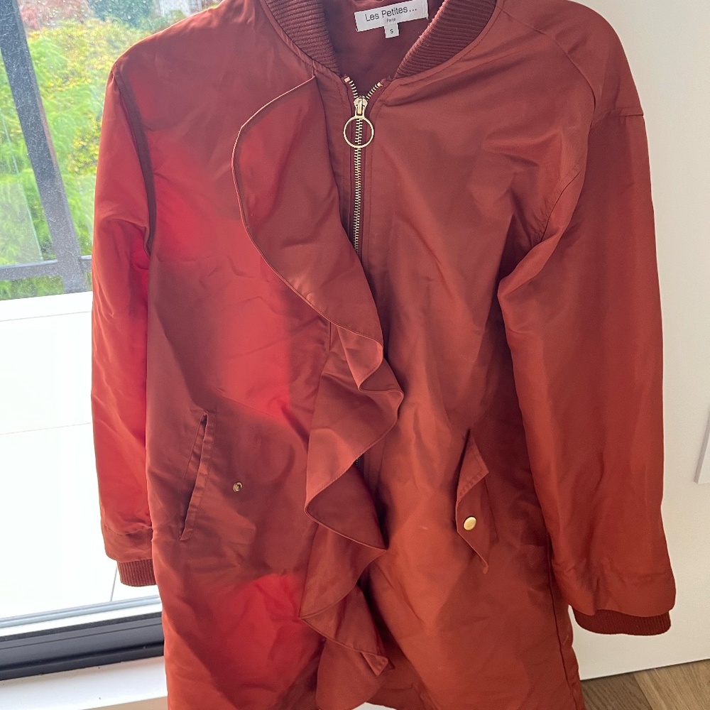 Ruffled front coat in burnt orange